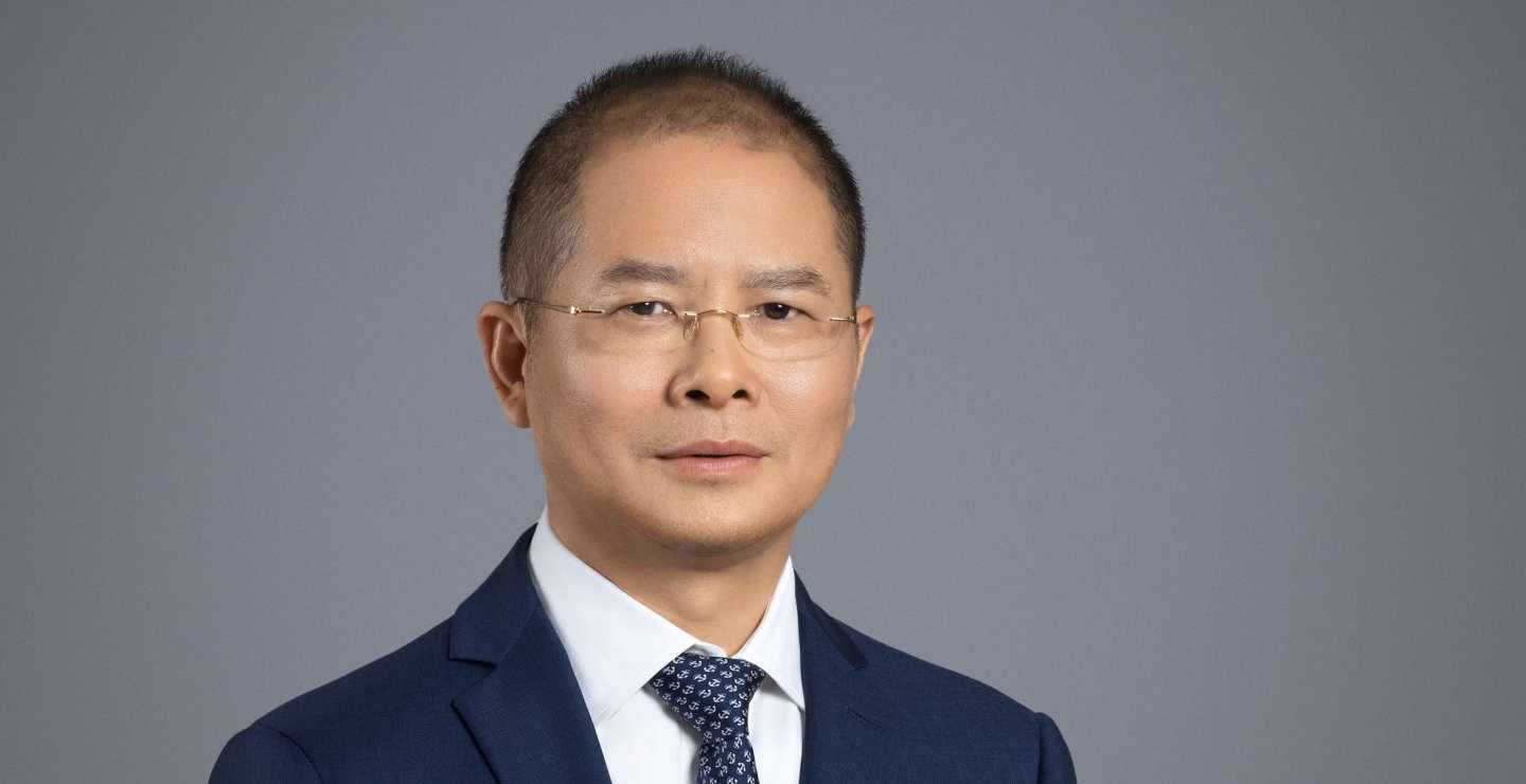 Article illustration of Eric Xu of Huawei. Article concerns new Ascend chip range from the company.